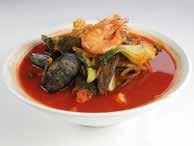 with seafood and vegetables in white broth
