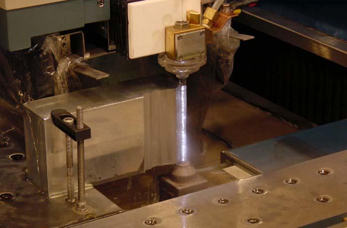 Wire EDM( Wire Electric Discharge Machining) A brass wire is fed through the workpiece submerged in a tank of dielectric fluid. It is used to cut plates as thick as 0.