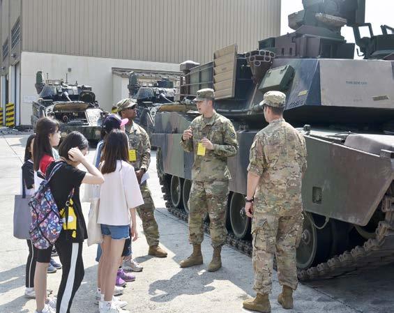 july 2018 7 CAMP CASEY PARTNERS UP WITH LOCAL SCHOOL Soldiers from 3rd Battalion, 69th Armor Regiment, 1st Armored Brigade Combat Team and volunteers took a group photo to commemorate their time with