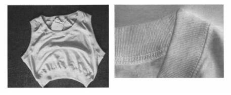 6110.20 XI 소매가 없는 옷 네크라인이 둥글고 상반신을 덮도록 디자인되어 있으며 그 끝이 허리 바로 위까지 내려온다. 풀오버와 유사한 이 의류는 전부 메리야스편물(100% 면)로 만들어진다.