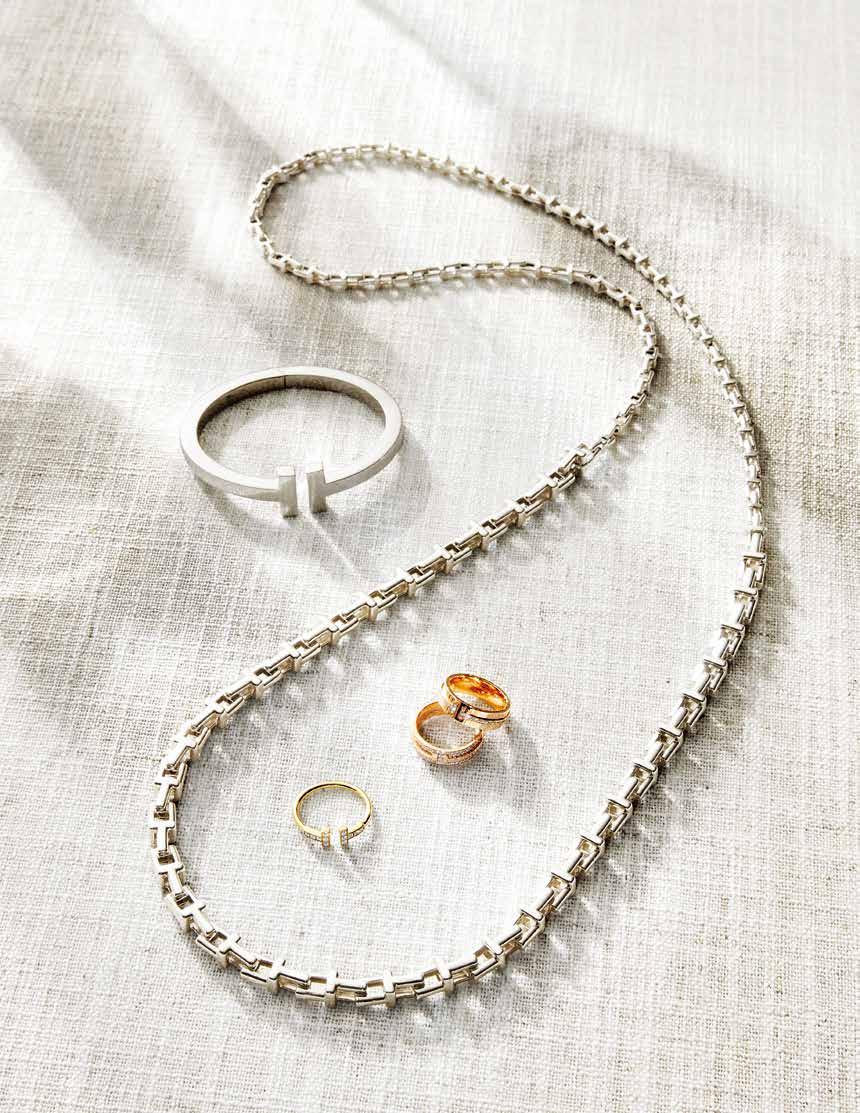 Hearts Bangle in 18k rose gold set with mother-of-pearl and diamond all CHOPARD (clockwise from left) Tiffany T Square Bracelet in sterling silver / Tiffany T Narrow Chain Necklace