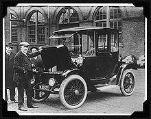 on top Thomas Edison and an electric car in
