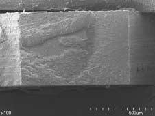 a b H A R Figure 4. SEM micrograph of the dentin surface of a debonded specimen in SB-continuous curing group. (a) Low magnification view ( 100).