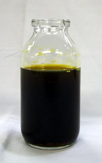 Figure 3. A bottle of fluid shows yellow-brownish bilious fluid from thoracic cavity via chest pigtail catheter.