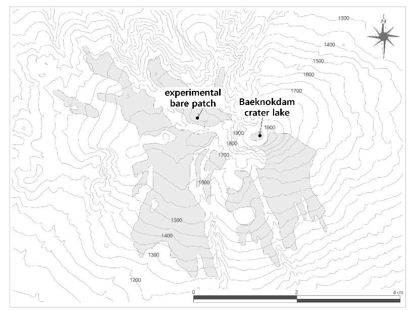 Figure 1. Distribution of the subalpine grassland (shade) of Mount Halla and the experimental bare patch in a northwestern gentle slope.