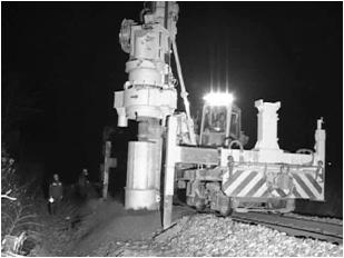 (a) Boring machine operating on railroad (b) Excavated hole for a foundation Fig. 3.
