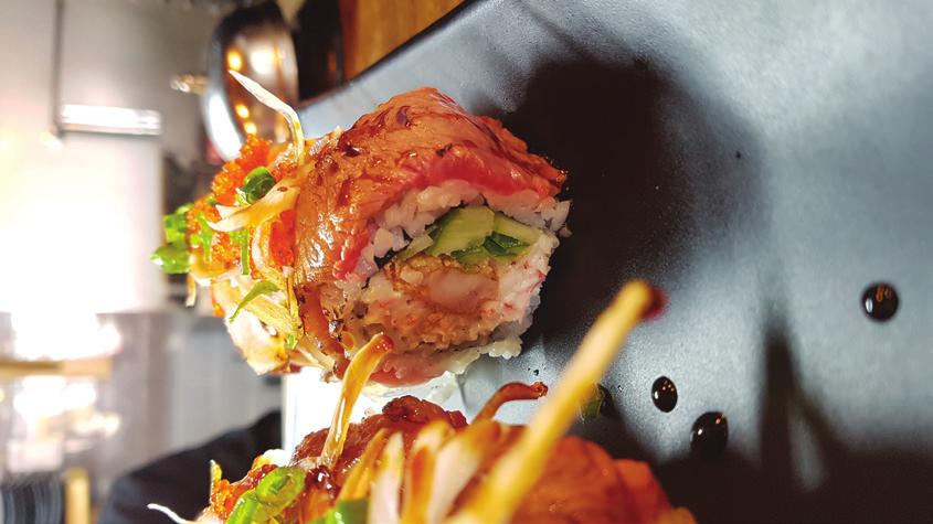 * Emugi * 이무기 California roll with shrimp tempura inside, fried soft-shell crab topping