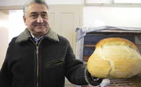 Church in Transcarpathia serves in faith Reformed communiqué Béla Nagy sharing bread from the community kitchen.