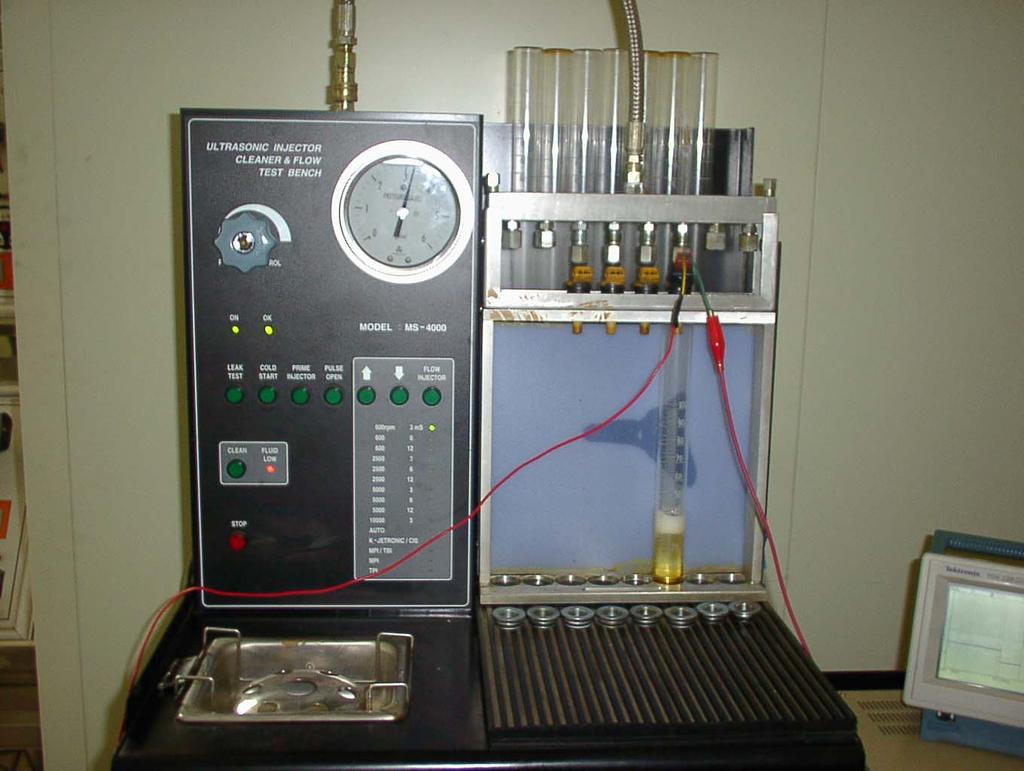 Photo 3.11 Apparatus for fuel injection test Fig. 3.64 Waveform of injector at 12V and 2.