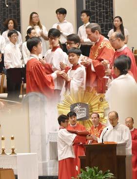 After the liturgy, Bishop Burbidge greeted newly confirmed students, their families and sponsors as well as other St. Paul Chung parishioners in the Parish Hall where the reception was held.