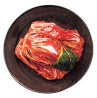 b baechu kimchi [ 배추김치 ] E Salted napa cabbage stuffed with a mixture of white radish, red chili powder, minced garlic and salted fish.