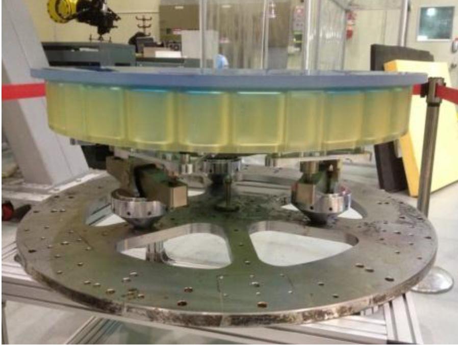 The FSM prototype mirror developed in Korea (left) in the grinding and early polishing stage and (right) in the final polishing and testing stage. (Photo from Cho, et al.